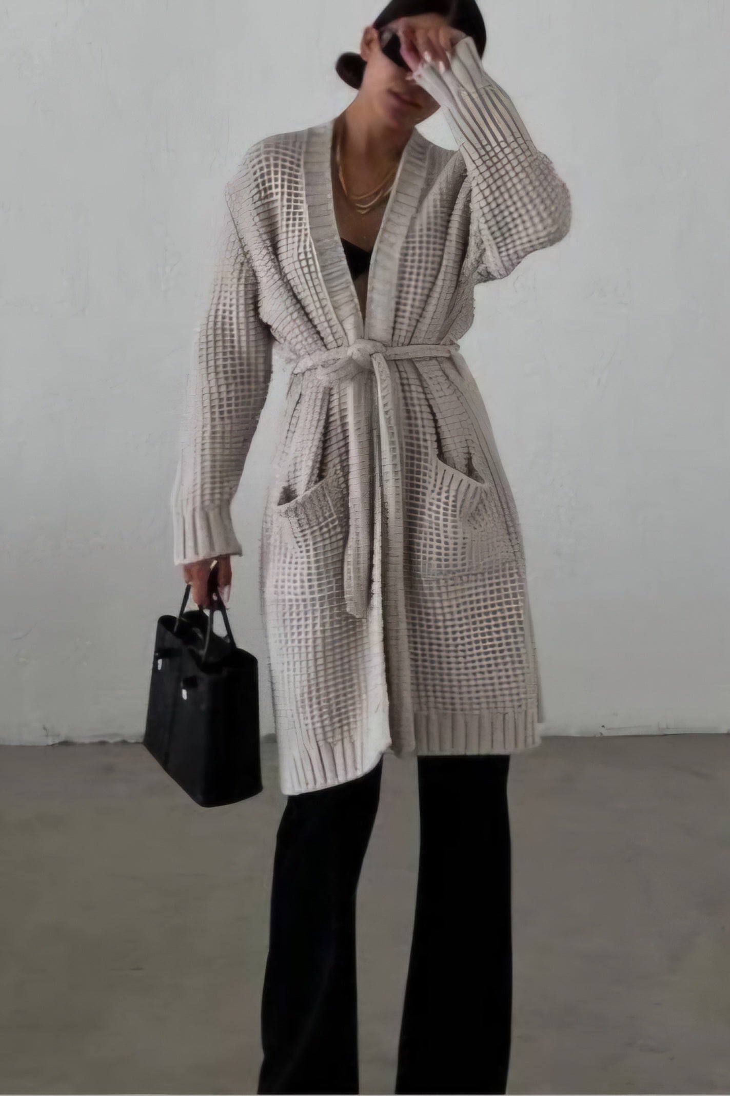 Knitted cardigan with a belt